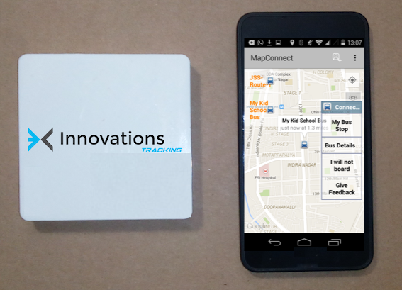 Innovations Tracking GPS device next to a phone running the tracking app